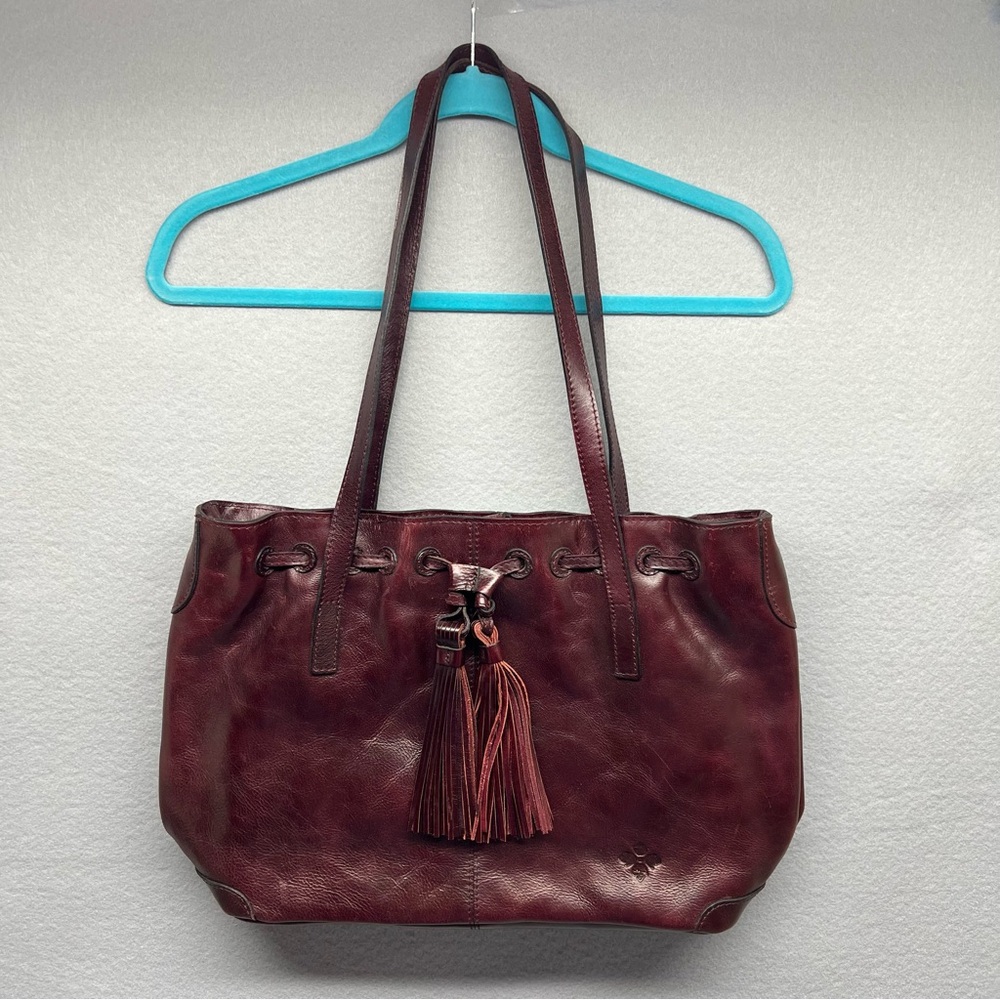 Patricia Nash Witney Distressed Plum Oxblood Leather Tassel Drawstring Tote Bag